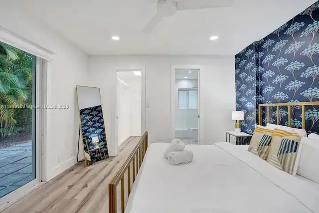 a bedroom with furniture and a wooden floor