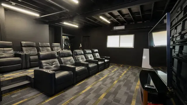 a media room with lots of chairs and a projector