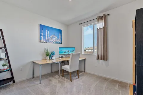 a workspace with furniture and window