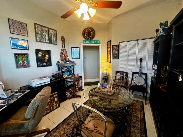 a living room with furniture flat screen tv and a fireplace