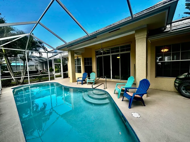 a view of a swimming pool with a lounge chair