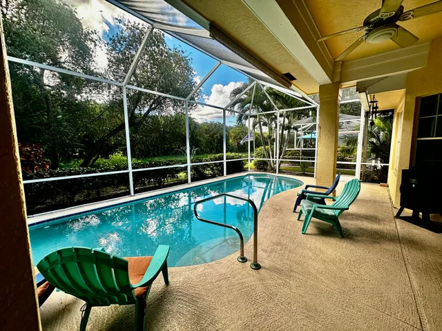 a view of a chairs and table in the patio