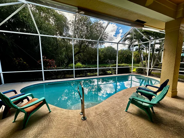 a view of a two chairs in the balcony