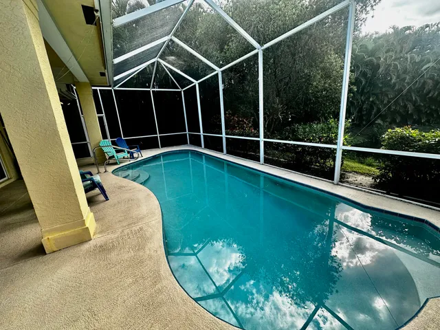 a view of a swimming pool with a garden