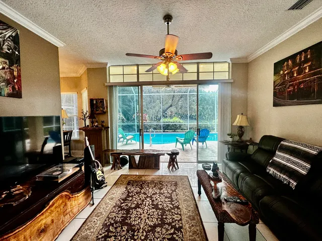 a living room with furniture fireplace and a flat screen tv