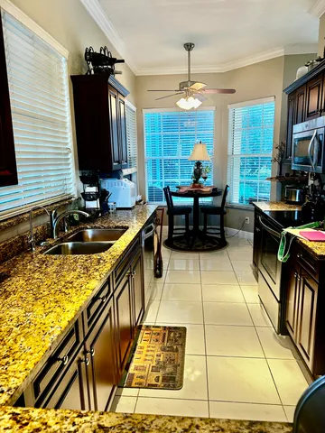 a lobby with furniture and a rug