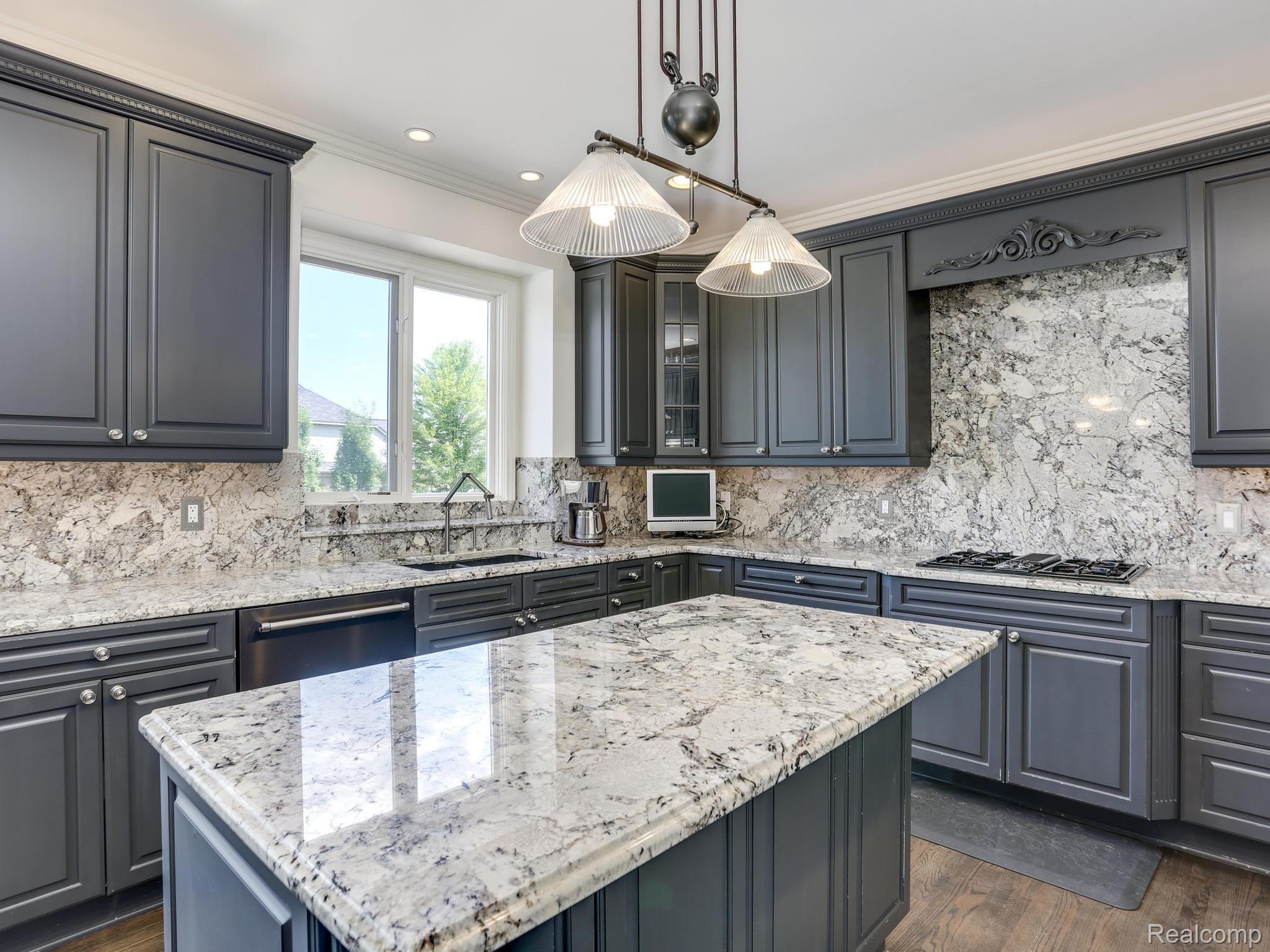 5323 Carlisle Court Rochester, MI 48306 - Photo 19 of 57 Granite countertops and backsplash