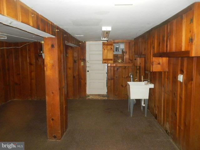 5715 Simmonds Avenue Baltimore, MD 21215 - Photo 8 of 12 a view of a bathroom with a sink and mirror
