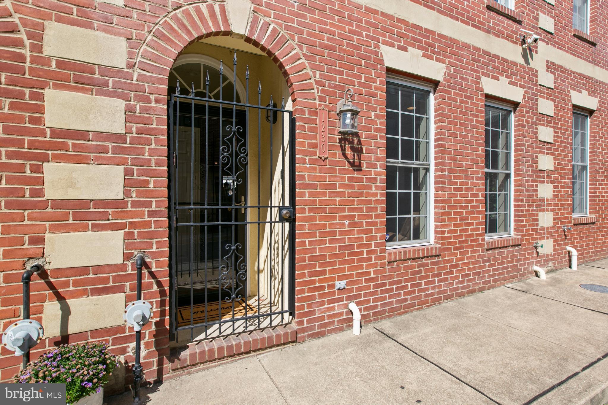 1230 Cooksie Street Baltimore, MD 21230 - Photo 2 of 41 a front view of a house with a garage