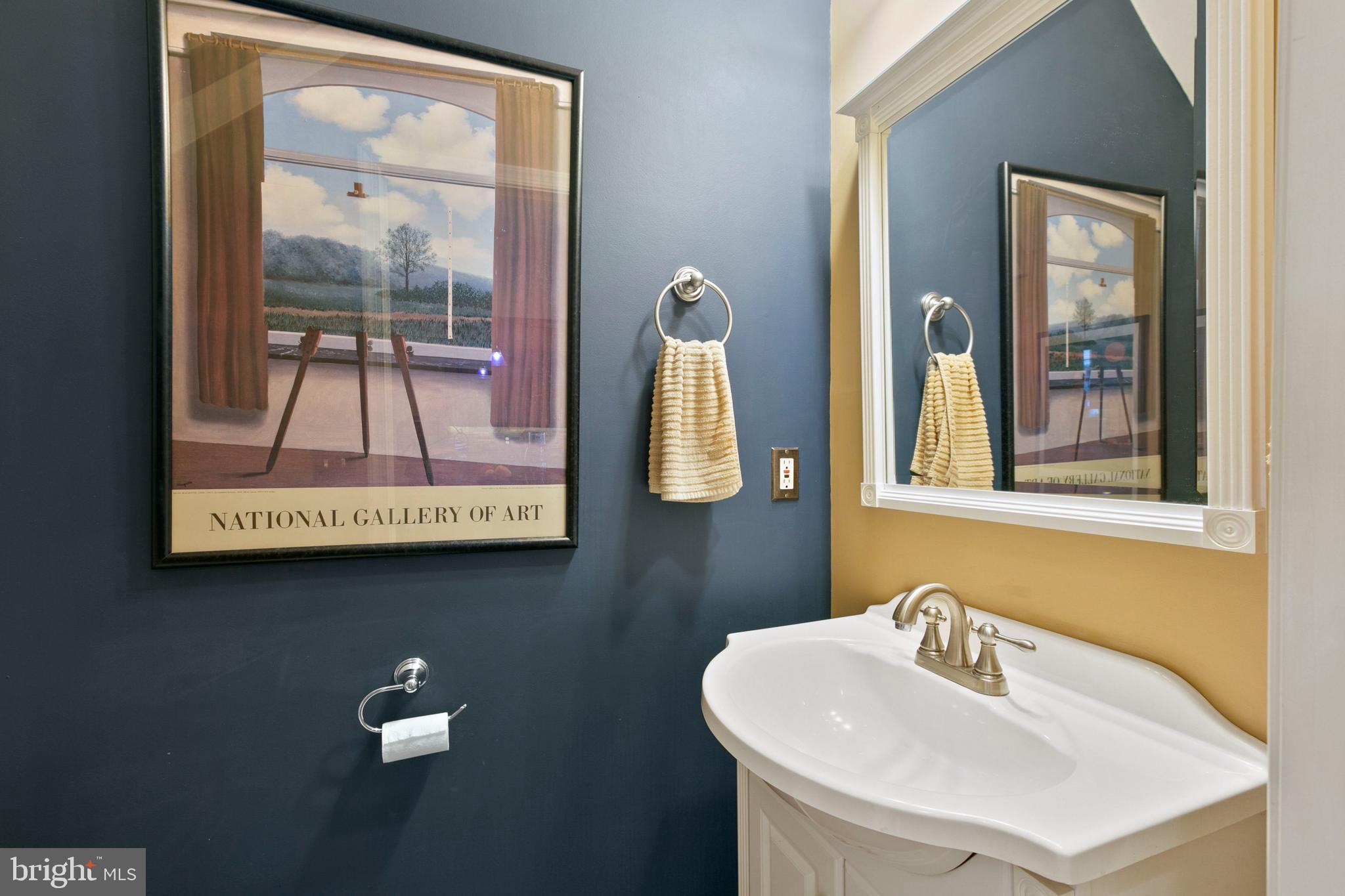 1230 Cooksie Street Baltimore, MD 21230 - Photo 14 of 41 a bathroom with a sink and a mirror