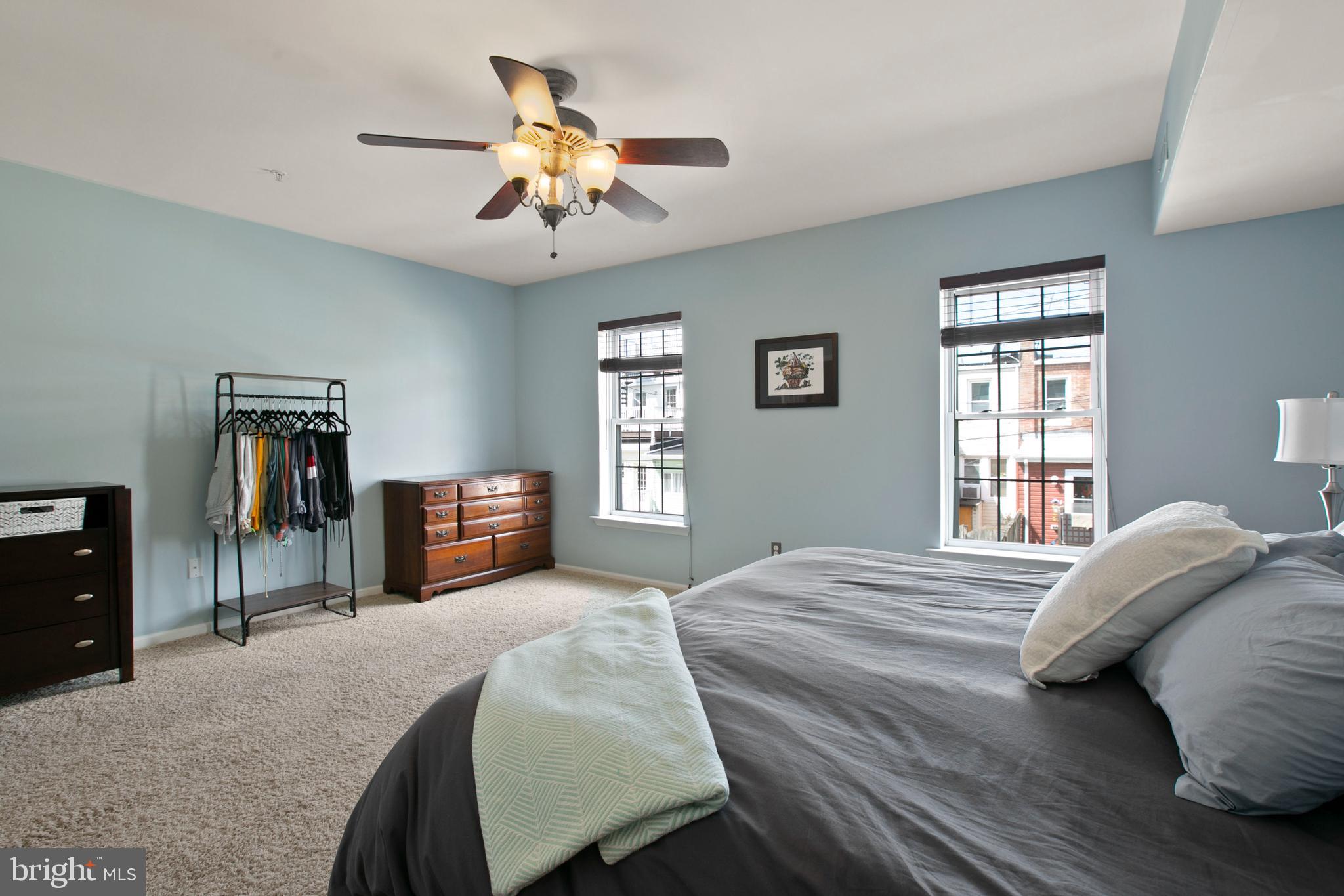 1230 Cooksie Street Baltimore, MD 21230 - Photo 20 of 41 a bedroom with a bed dresser and a window