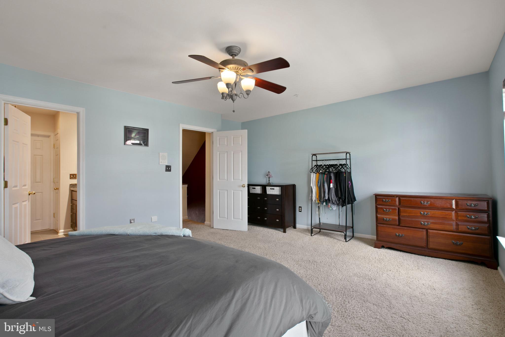 1230 Cooksie Street Baltimore, MD 21230 - Photo 21 of 41 a bedroom with furniture and a chandelier