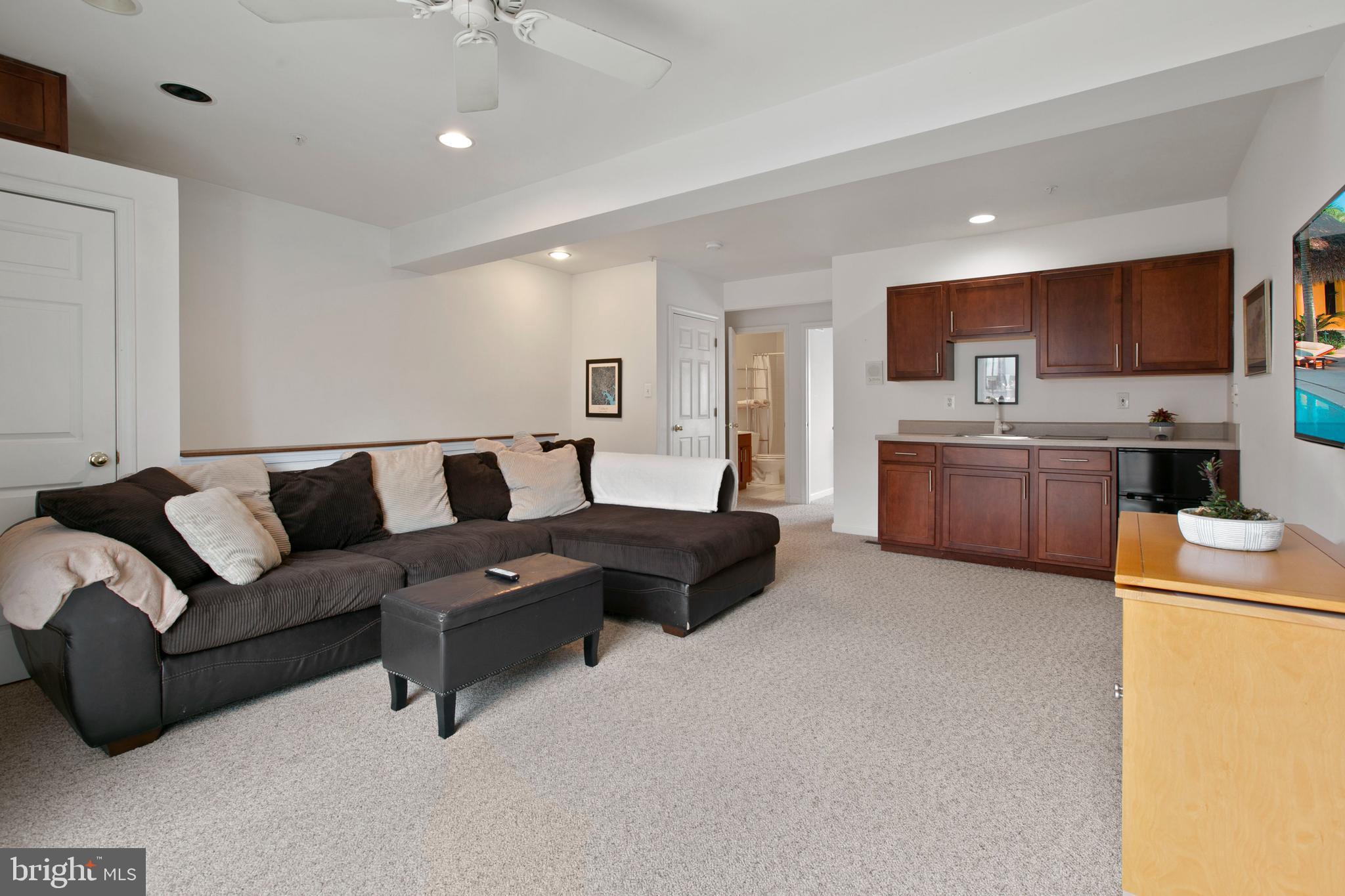 1230 Cooksie Street Baltimore, MD 21230 - Photo 28 of 41 a living room with furniture and a kitchen