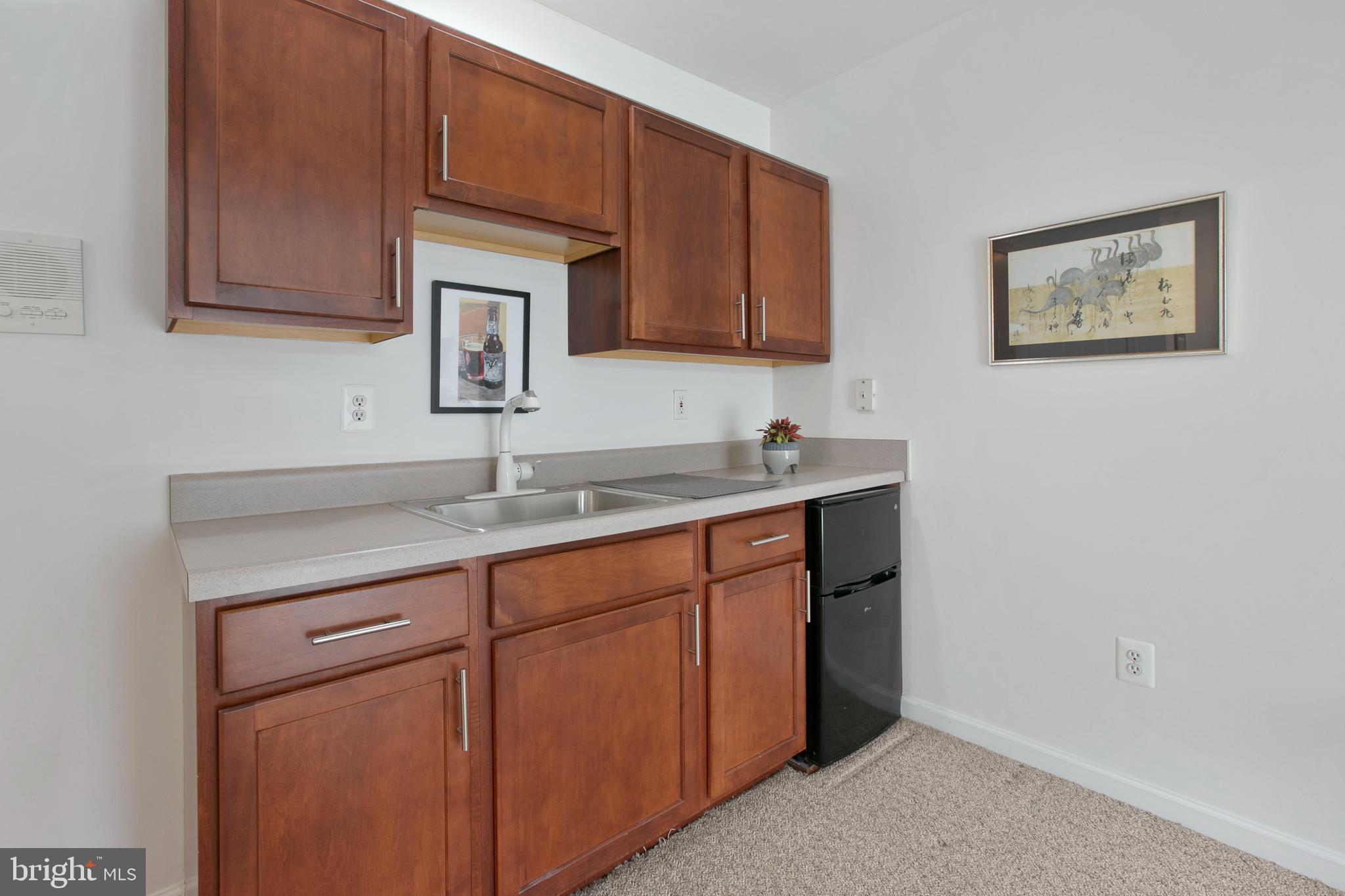 1230 Cooksie Street Baltimore, MD 21230 - Photo 29 of 41 a kitchen with stainless steel appliances granite countertop a sink and cabinets