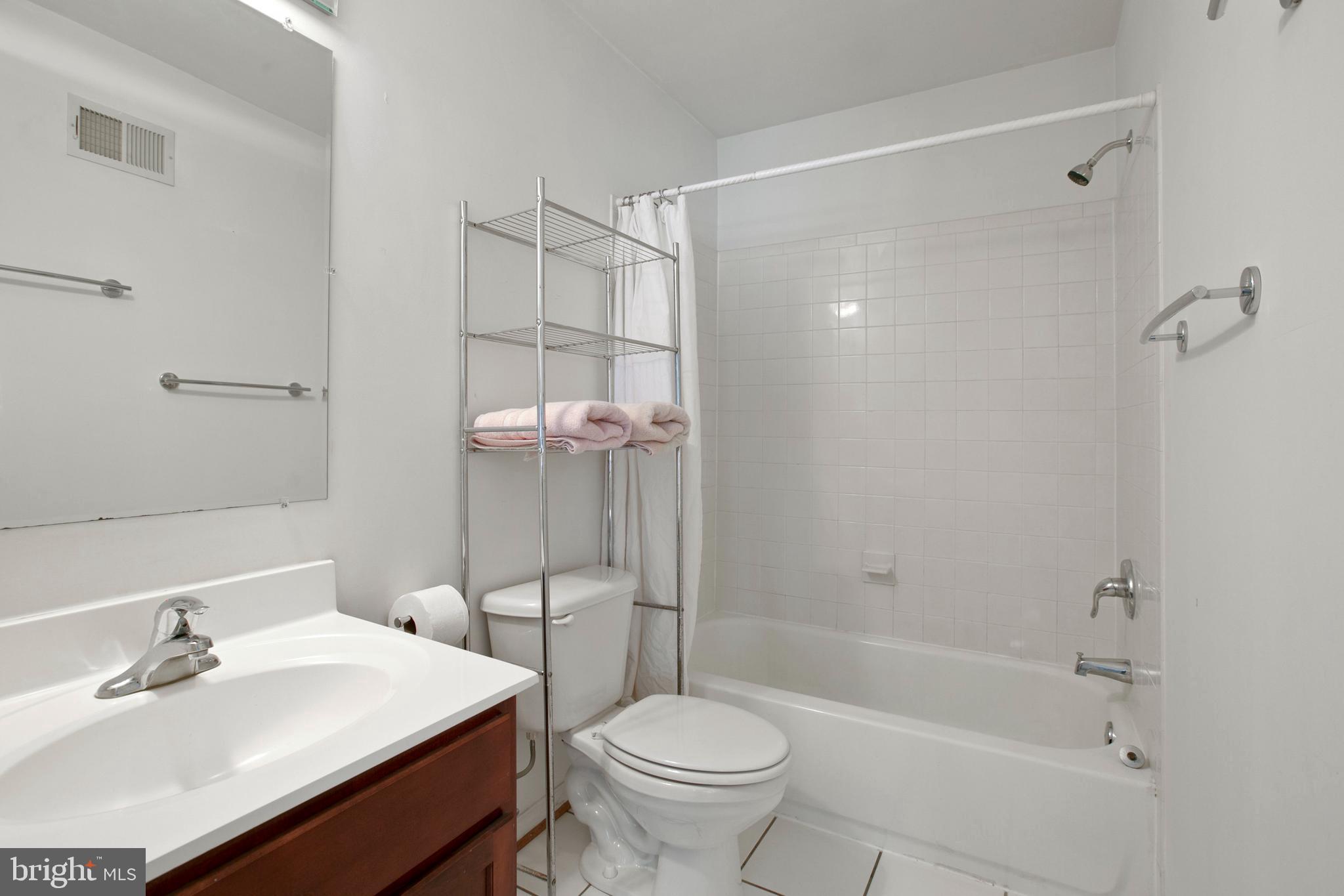 1230 Cooksie Street Baltimore, MD 21230 - Photo 30 of 41 a bathroom with a sink toilet and shower