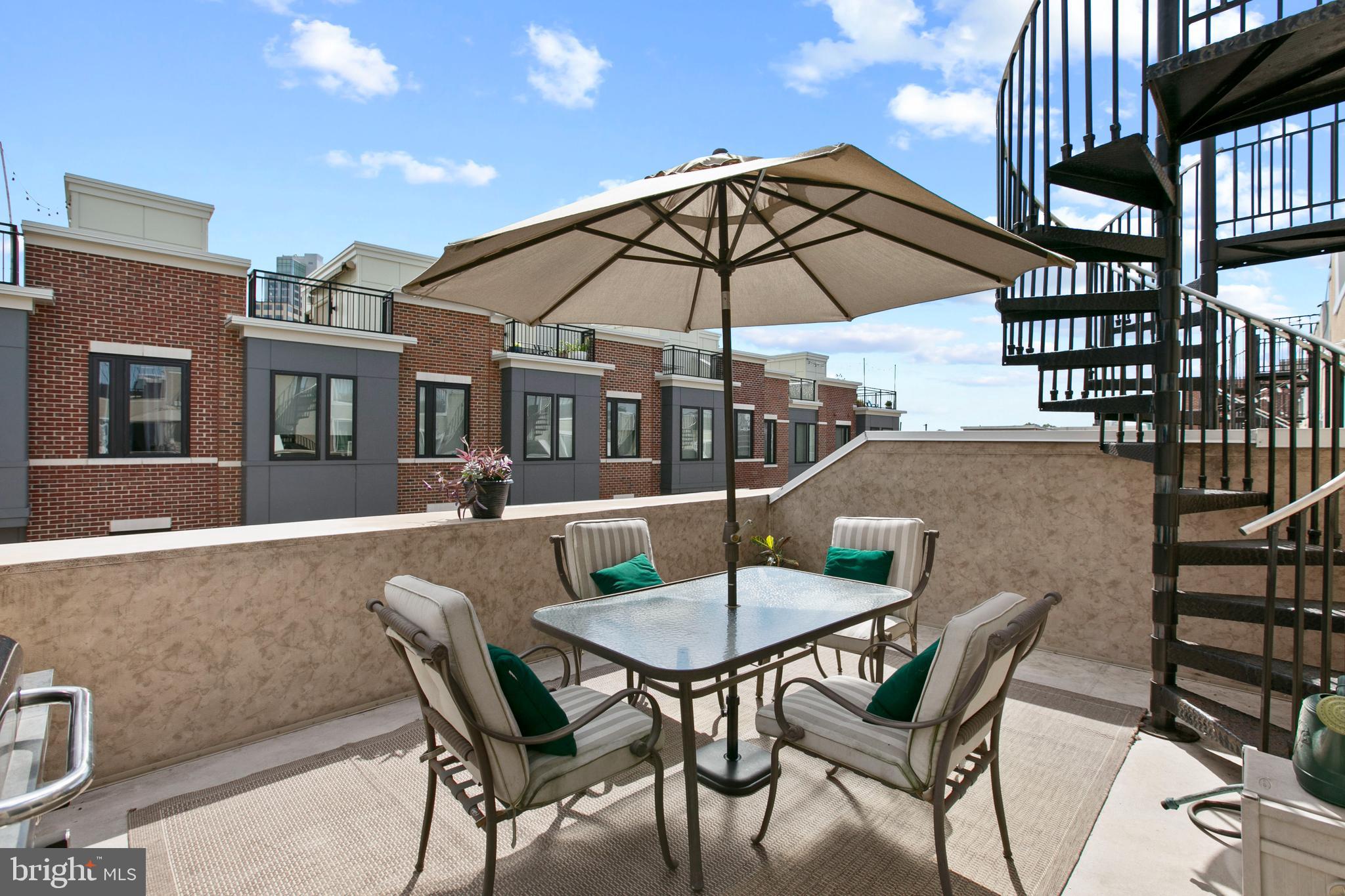1230 Cooksie Street Baltimore, MD 21230 - Photo 33 of 41 a patio with a table and chairs