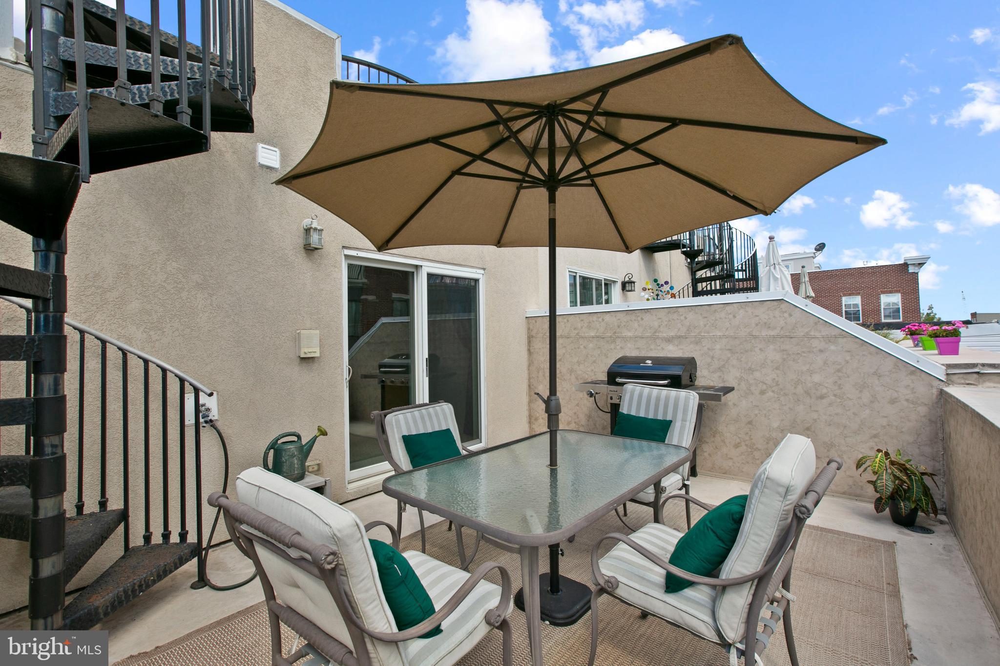 1230 Cooksie Street Baltimore, MD 21230 - Photo 34 of 41 a patio with a table and chairs