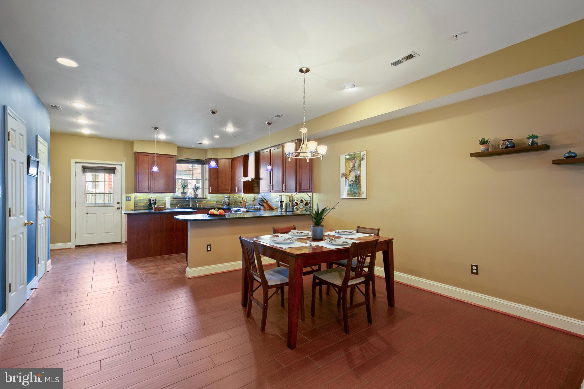 1230 Cooksie Street Baltimore, MD 21230 - Photo 7 of 41 a kitchen with a table and chairs in it