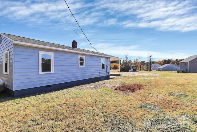 a view of a backyard of the house
