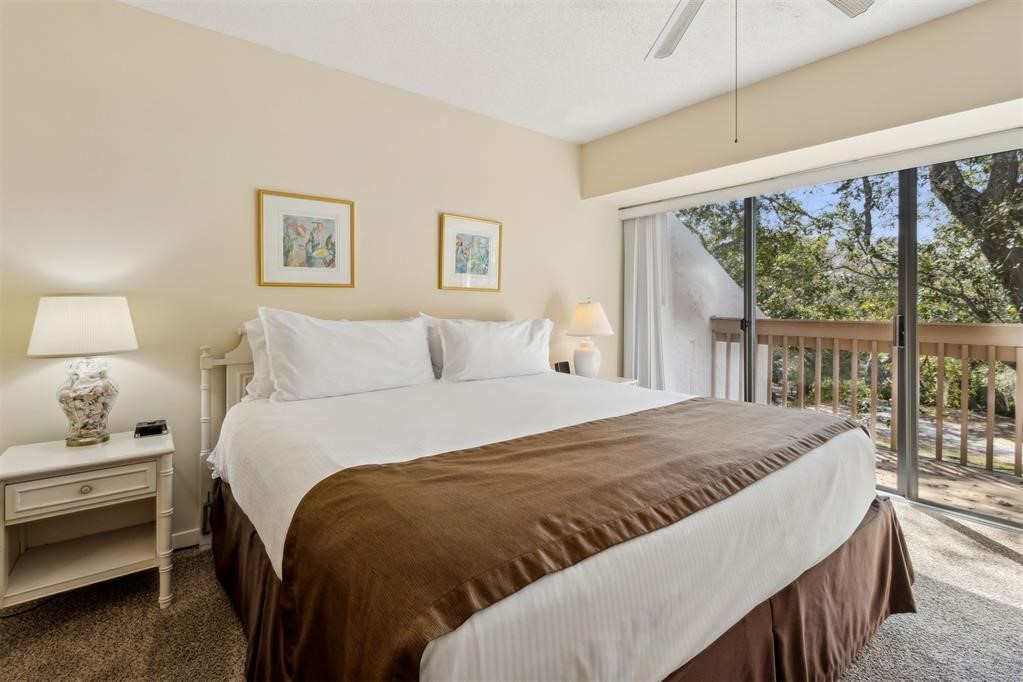 2004 Beachwood Road, Unit 2004 Fernandina Beach, FL 32034 - Photo 27 of 54 a bedroom with a bed and a large window
