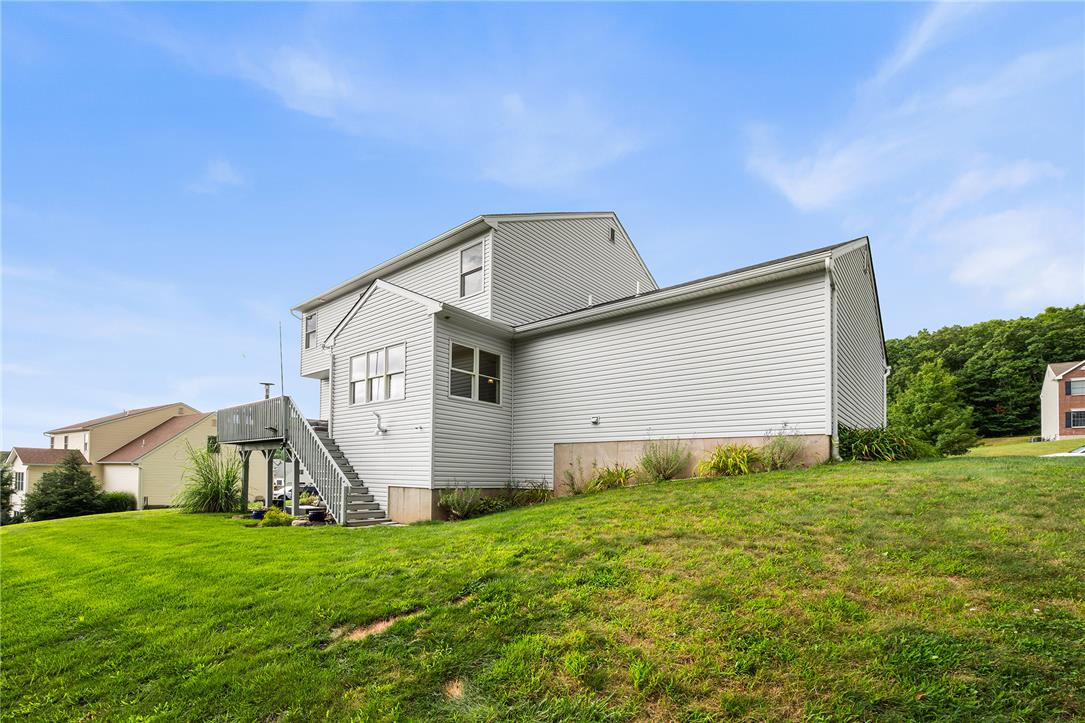 487 Long Run Road Drums, PA 18222 - Photo 7 of 35 An elevated wood deck overlooks the expansive green lawn surrounding this multi-level home.