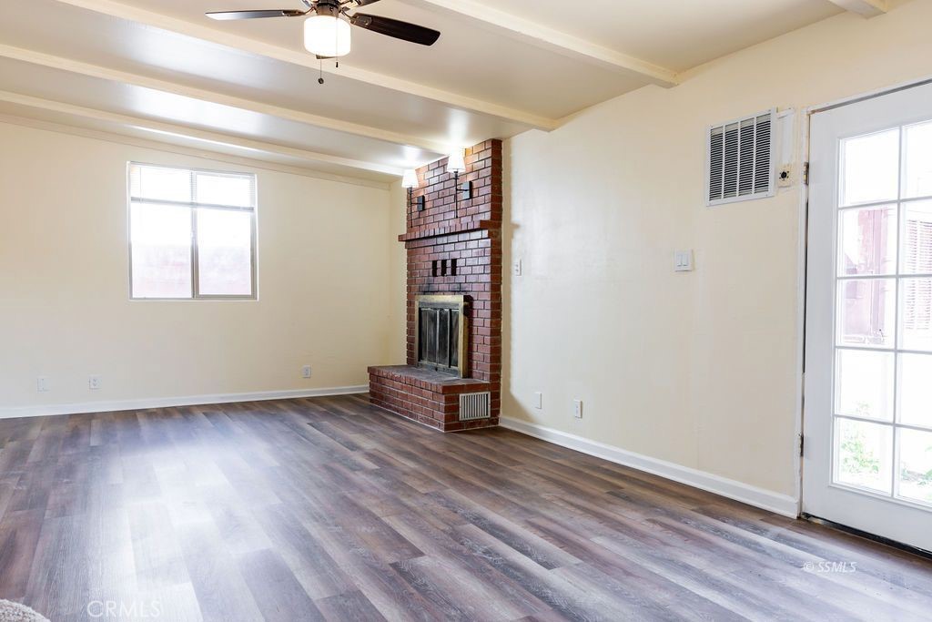 1500 West Alene Avenue Ridgecrest, CA 93555 - Photo 21 of 30 wooden floor in an empty room with a window