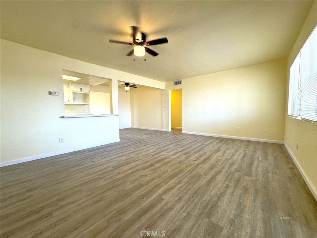 1500 West Alene Avenue Ridgecrest, CA 93555 - Photo 24 of 30 wooden floor in an empty room with a window