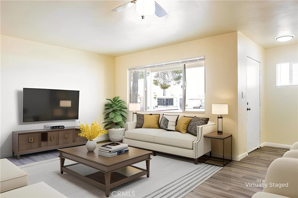 1500 West Alene Avenue Ridgecrest, CA 93555 - Photo 28 of 30 a living room with furniture a flat screen tv and a window