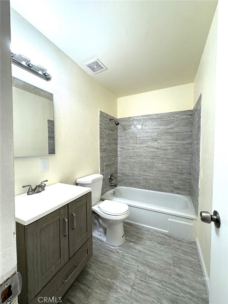 1500 West Alene Avenue Ridgecrest, CA 93555 - Photo 9 of 30 a bathroom with a double vanity sink toilet and shower