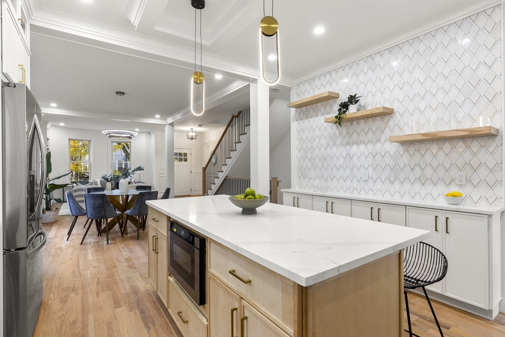 27 Coolidge Road, Unit 1 Boston, MA 02134 - Photo 12 of 41 a kitchen with a table chairs and a stove