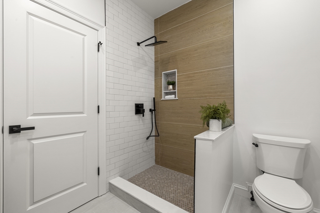 27 Coolidge Road, Unit 1 Boston, MA 02134 - Photo 26 of 41 a bathroom with a toilet and a shower