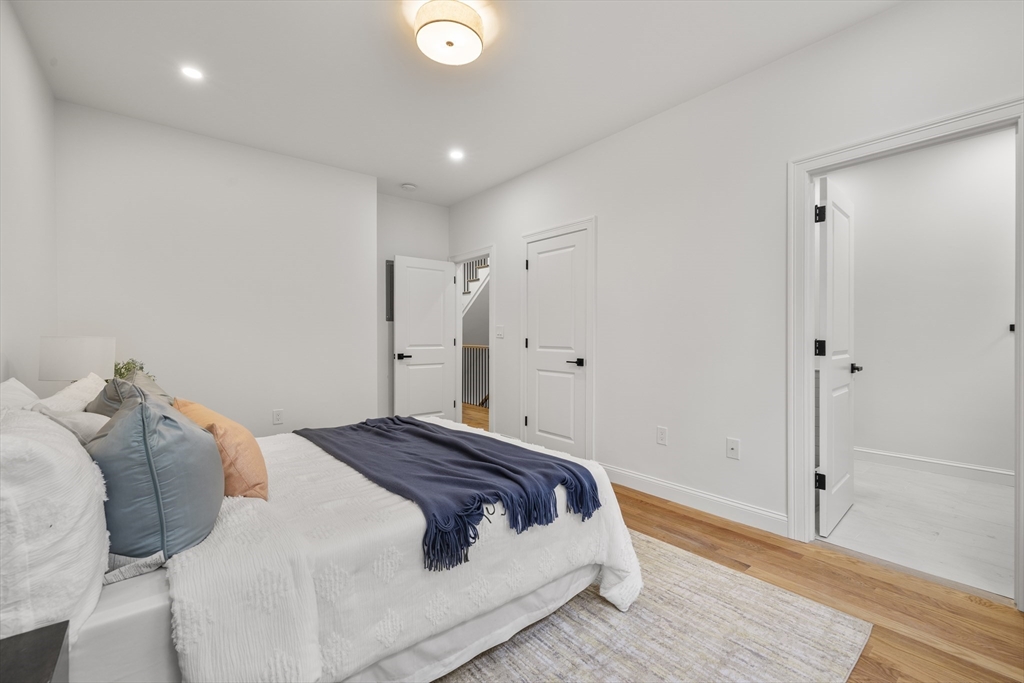 27 Coolidge Road, Unit 1 Boston, MA 02134 - Photo 27 of 41 a bedroom with a bed and a shower