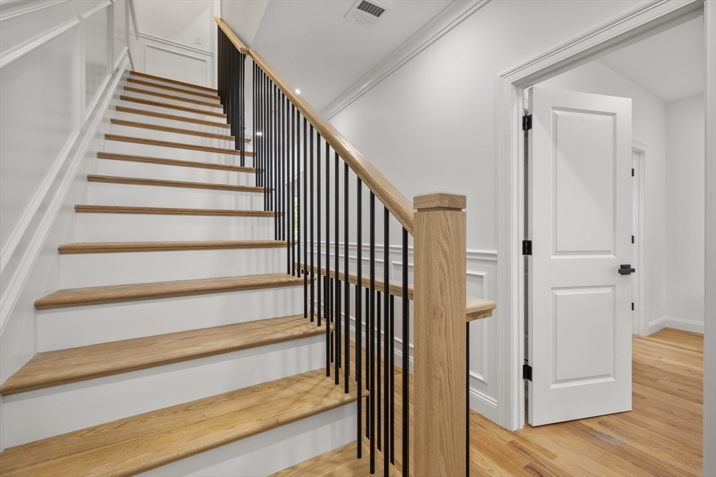 27 Coolidge Road, Unit 1 Boston, MA 02134 - Photo 28 of 41 a view of entryway with wooden floor and stairs