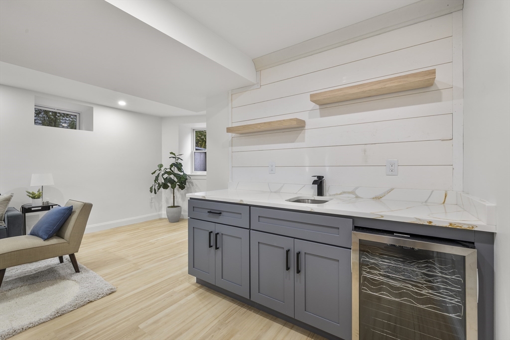 27 Coolidge Road, Unit 1 Boston, MA 02134 - Photo 33 of 41 a hallway with sink and mirror