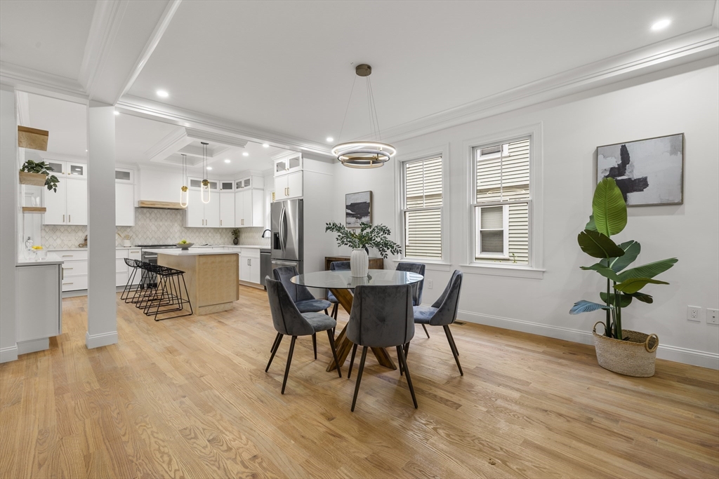 27 Coolidge Road, Unit 1 Boston, MA 02134 - Photo 4 of 41 a view of a dining room with furniture window and wooden floor