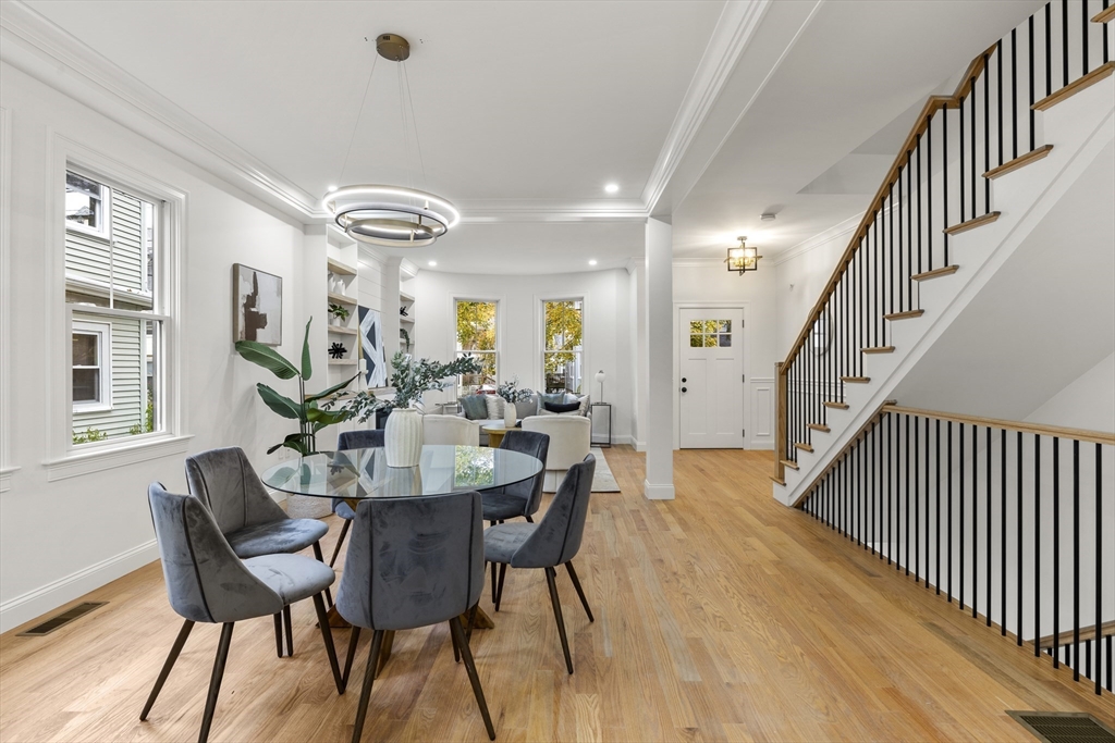 27 Coolidge Road, Unit 1 Boston, MA 02134 - Photo 6 of 41 a view of a dining room with furniture and wooden floor