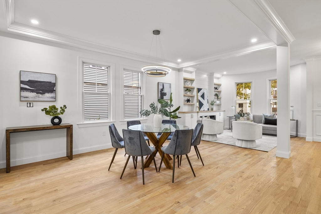27 Coolidge Road, Unit 1 Boston, MA 02134 - Photo 7 of 41 a view of a dining room with furniture and wooden floor