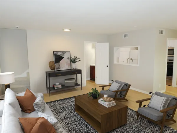 a living room with furniture and a rug
