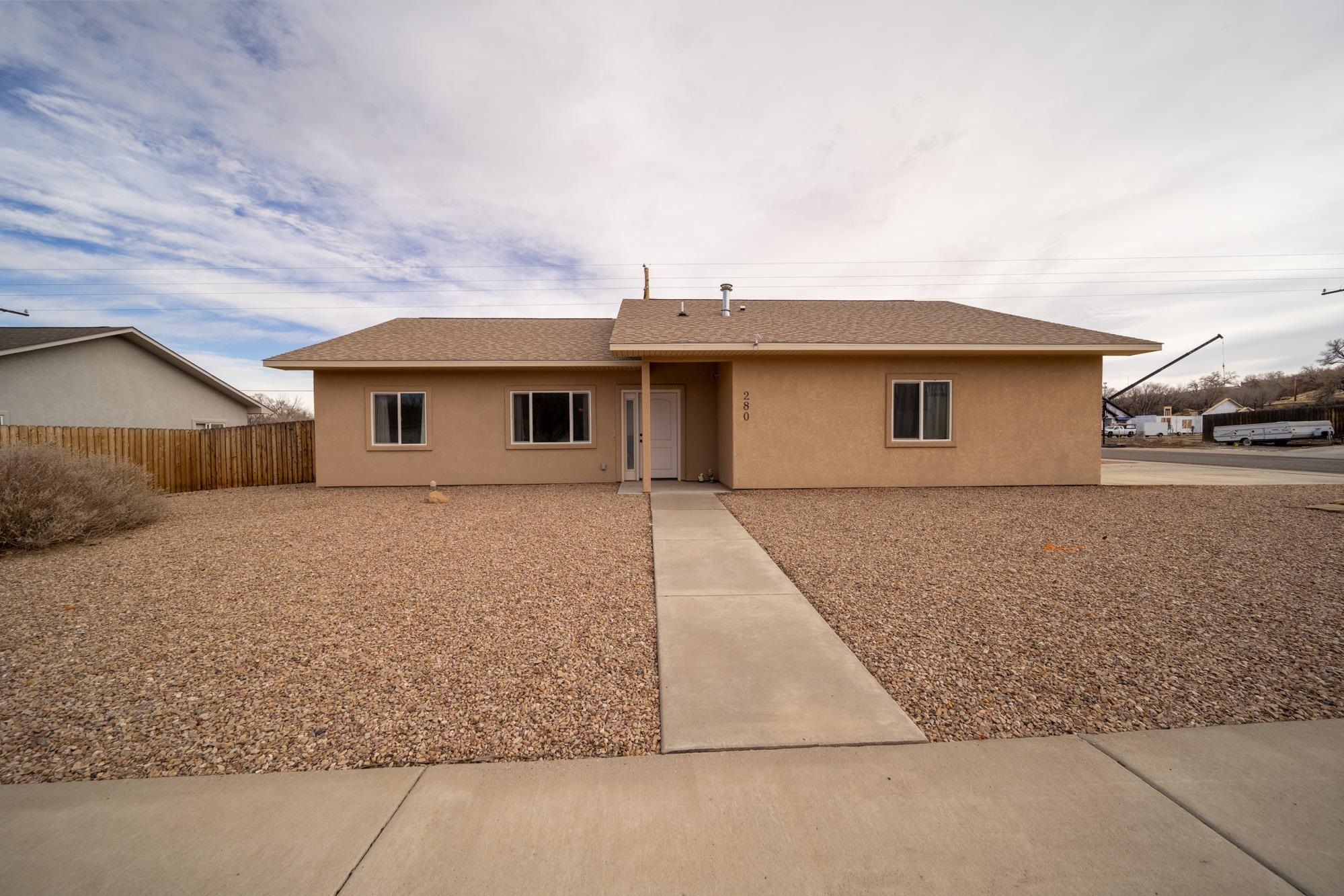 280 Gettysburg Street Grand Junction, CO 81503 - Photo 1 of 29 a front view of a house with a yard and garage