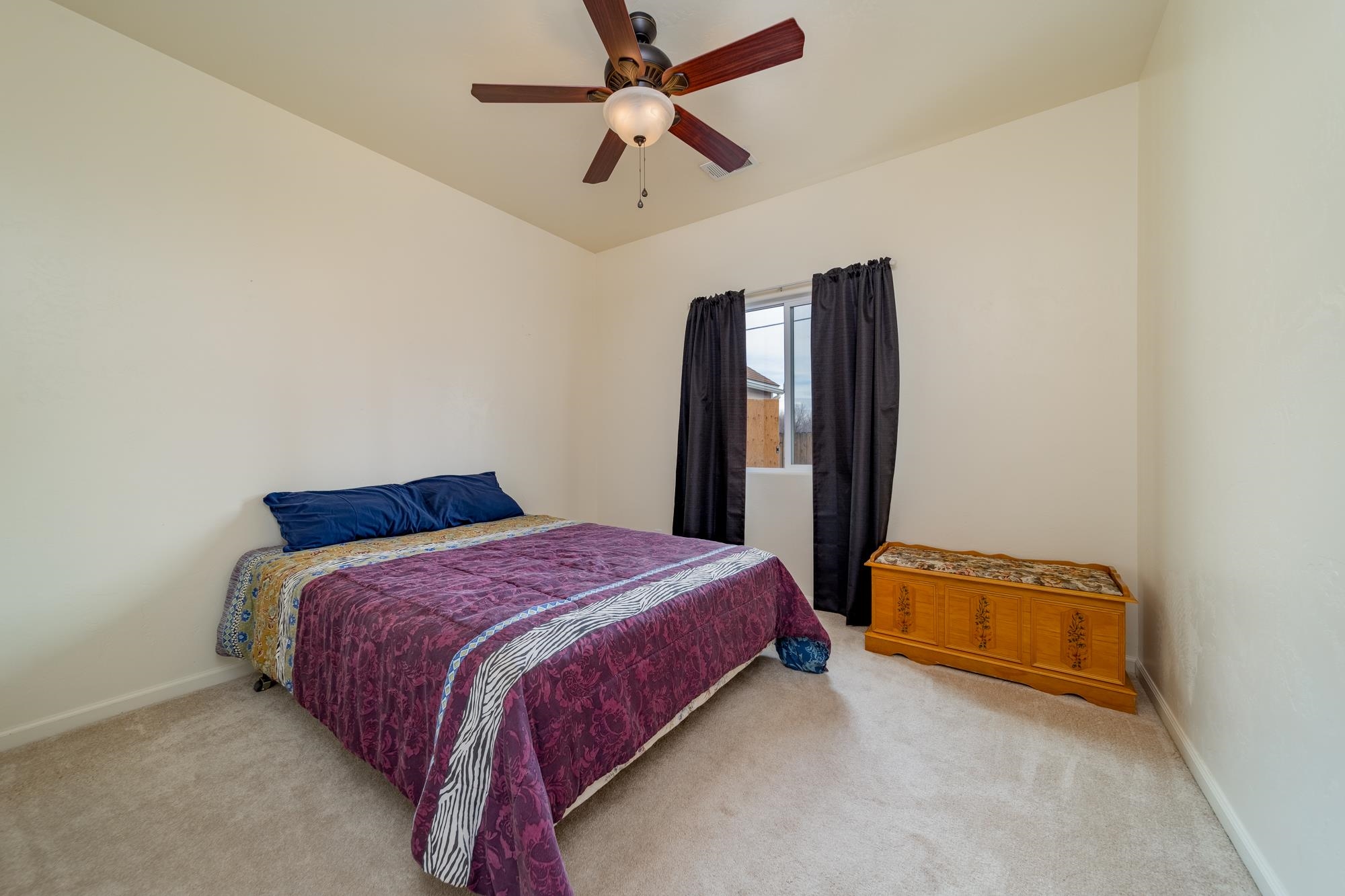 280 Gettysburg Street Grand Junction, CO 81503 - Photo 13 of 29 a bedroom with a bed and a ceiling fan
