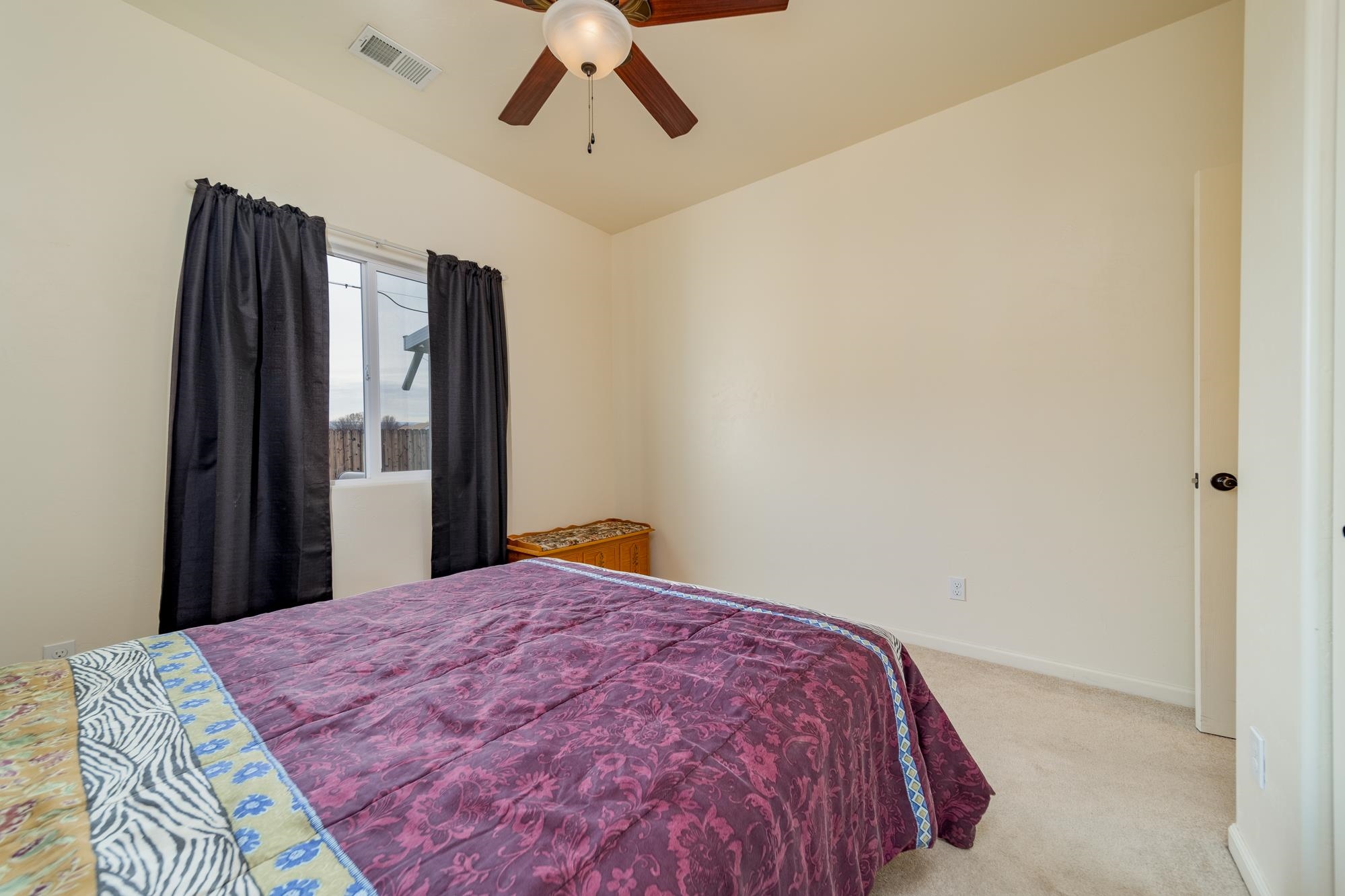 280 Gettysburg Street Grand Junction, CO 81503 - Photo 15 of 29 a bed sitting in a bedroom and a chandelier