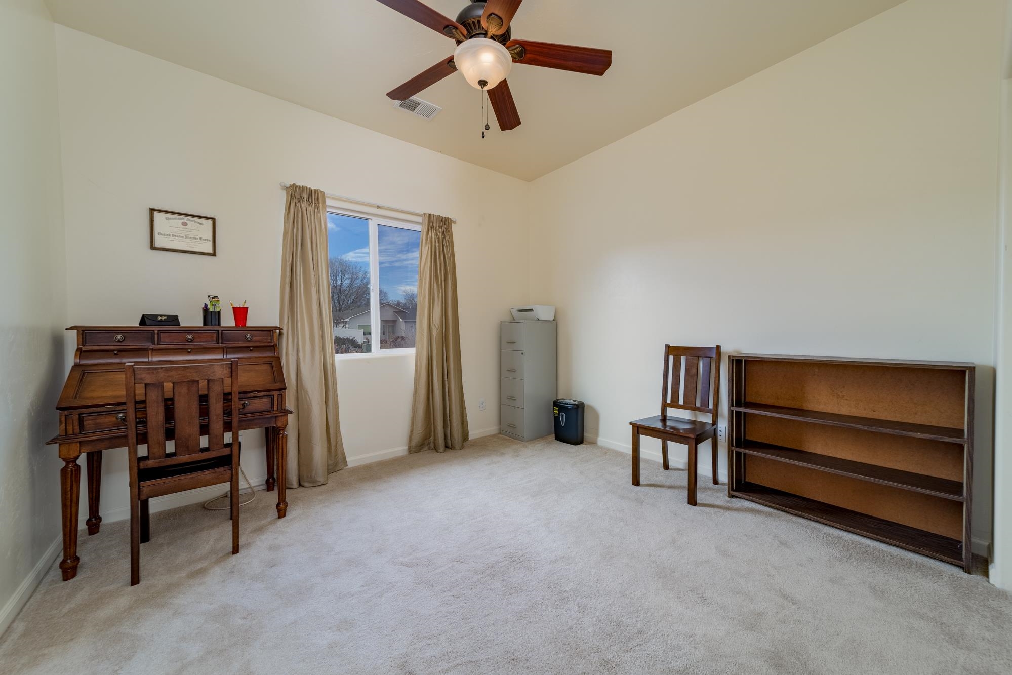 280 Gettysburg Street Grand Junction, CO 81503 - Photo 17 of 29 a furnished livingroom with a projector and furniture