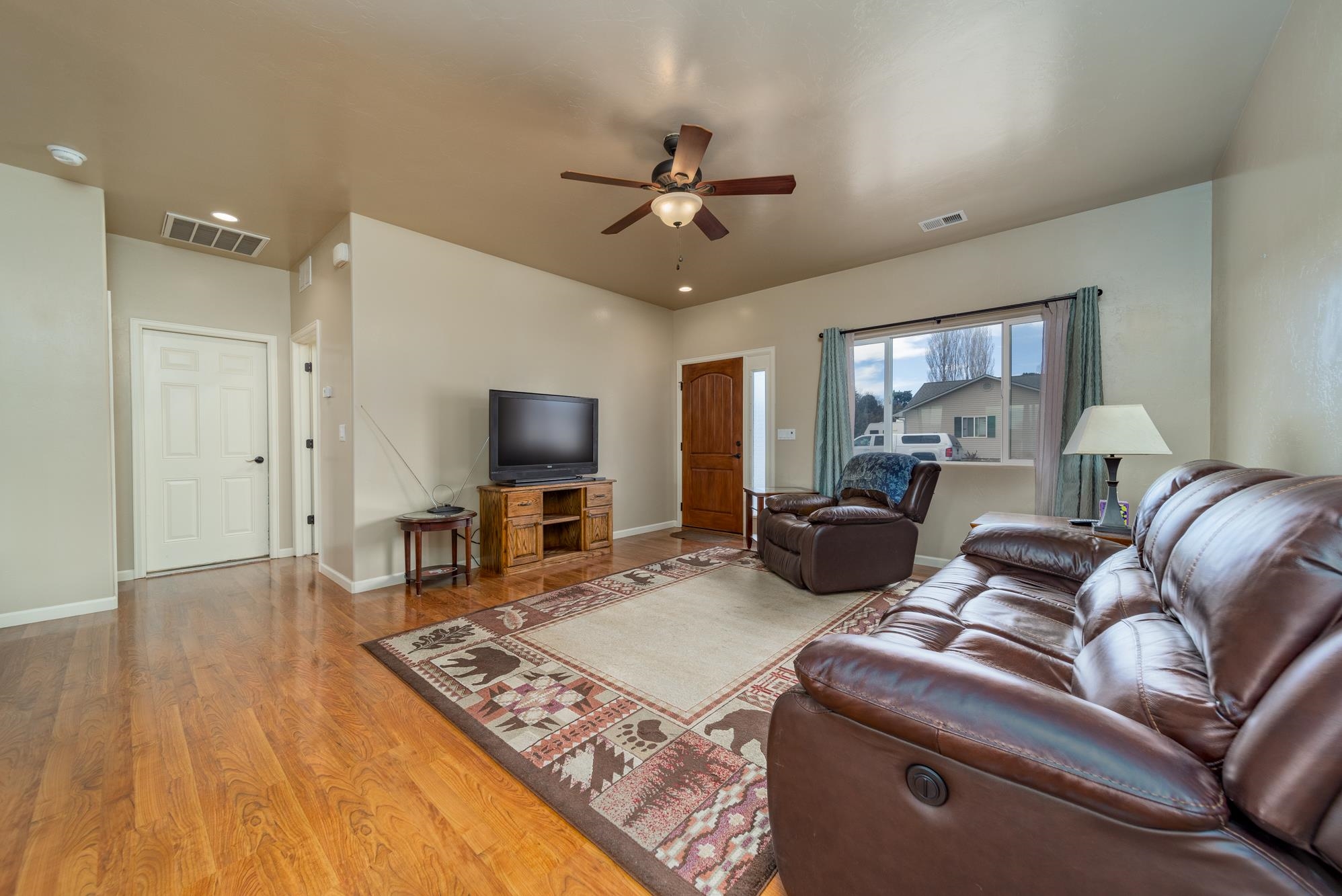 280 Gettysburg Street Grand Junction, CO 81503 - Photo 2 of 29 a living room with furniture a flat screen tv and kitchen view