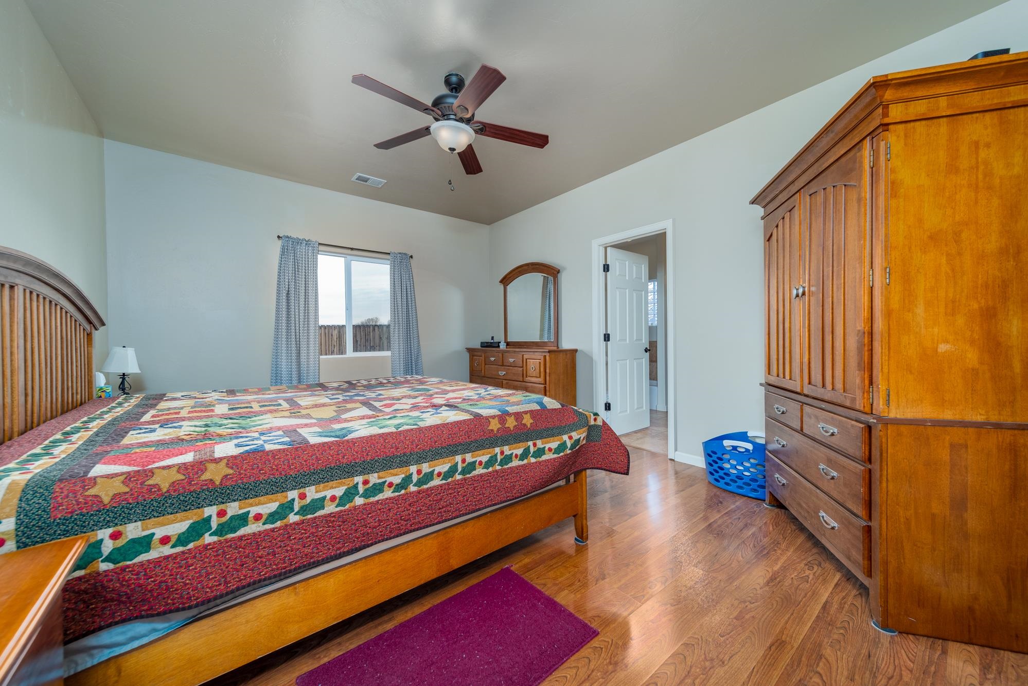 280 Gettysburg Street Grand Junction, CO 81503 - Photo 8 of 29 a bedroom with a bed and a chandelier