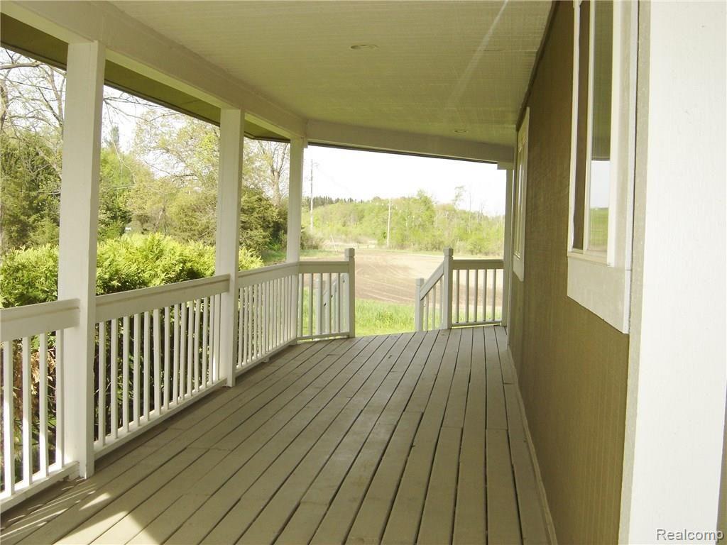 4378 Chase Lake Road Howell, MI 48855 - Photo 3 of 19 Wrap-around 58' covered porch
