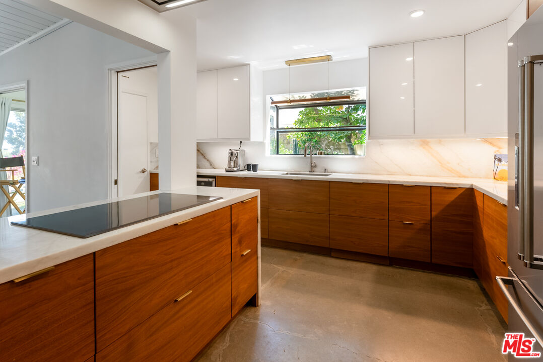 7211 Chelan Way Los Angeles, CA 90068 - Photo 14 of 38 a kitchen with stainless steel appliances granite countertop a sink a stove and a refrigerator