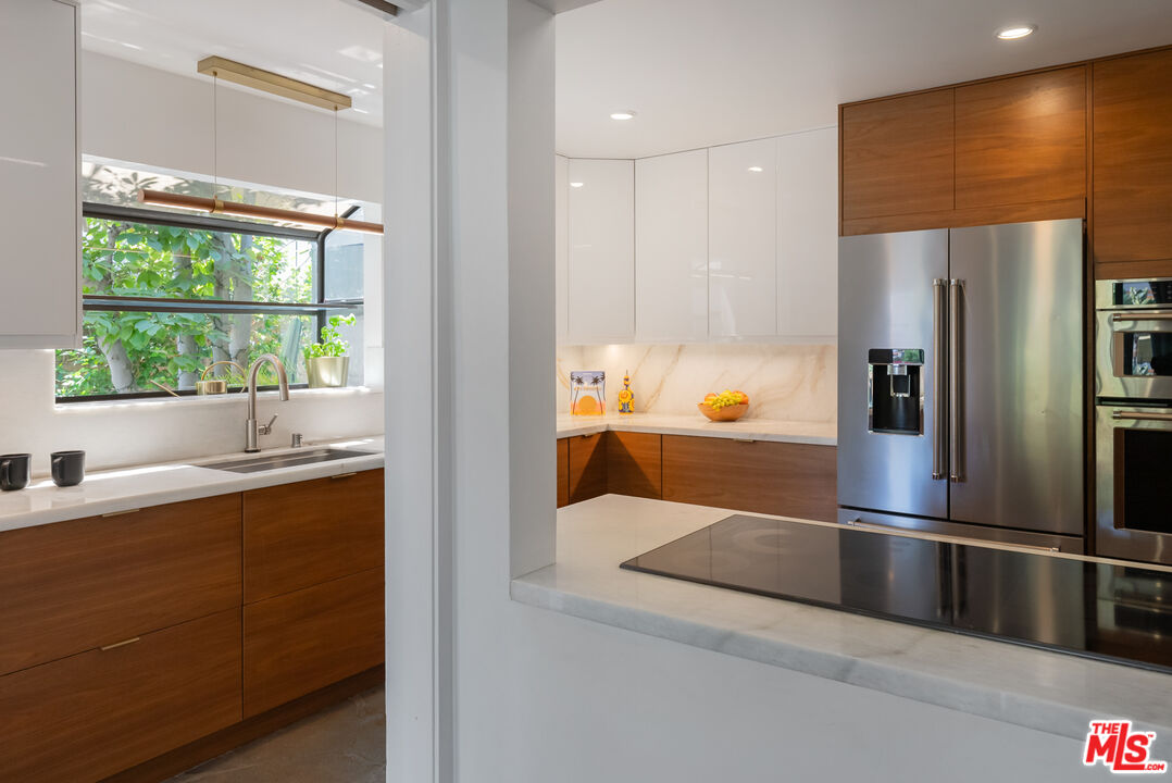 7211 Chelan Way Los Angeles, CA 90068 - Photo 15 of 38 a kitchen with stainless steel appliances a refrigerator and a sink