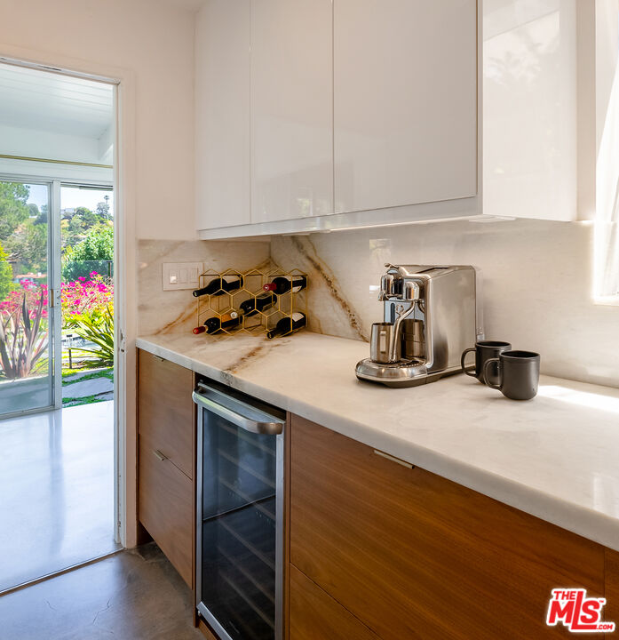 7211 Chelan Way Los Angeles, CA 90068 - Photo 16 of 38 a kitchen with a sink a stove and cabinets