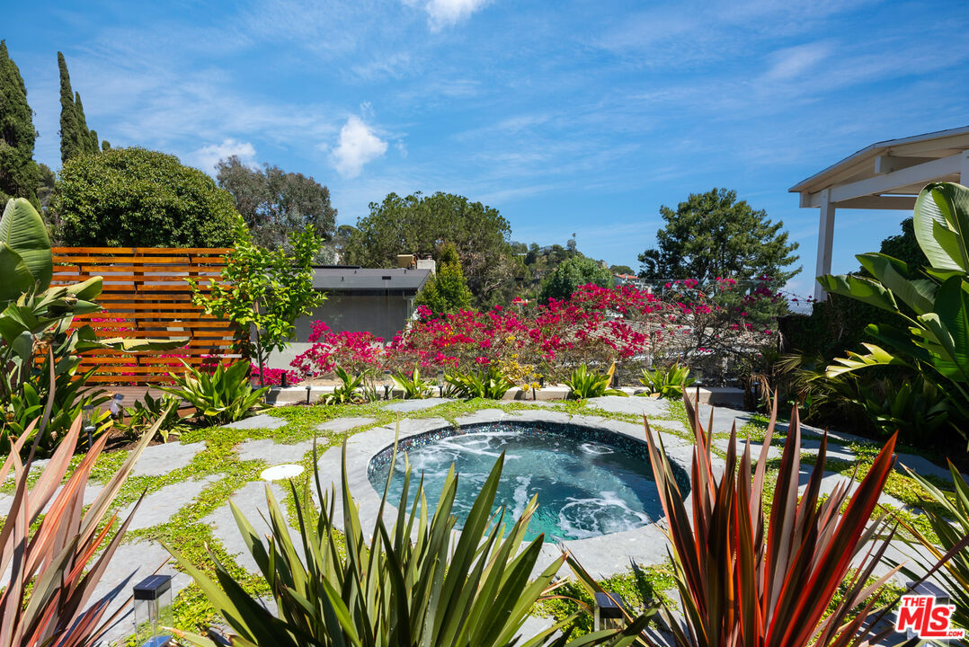 7211 Chelan Way Los Angeles, CA 90068 - Photo 27 of 38 a view of yard with seating area and trees around