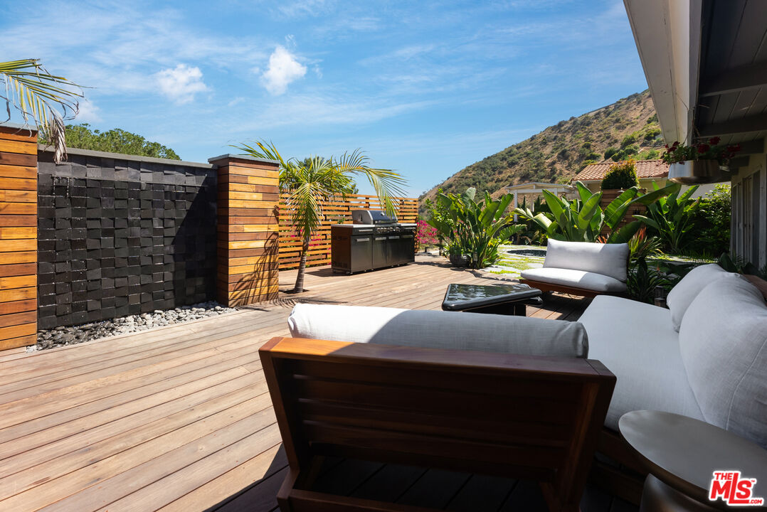 7211 Chelan Way Los Angeles, CA 90068 - Photo 30 of 38 a outdoor space with patio the couches and a fireplace